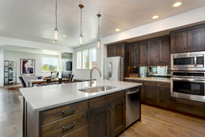 Photo of the open-concept kitchen and living room in The Sutton, an end-unit townhome.